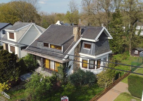 Bois de Neuville (Neupré): villa 4 façades avec jardin et garage dans un environnement idyllique.